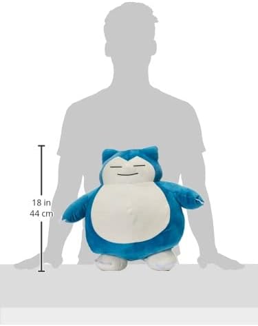 Snorlax plush toy with size measurement against a silhouette of a person on a white background