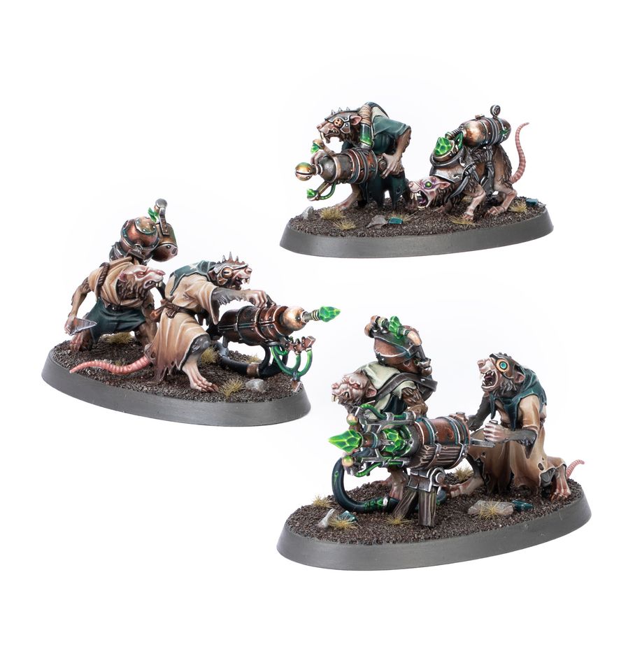 Three miniature figurines on gray bases with detailed designs on a white background