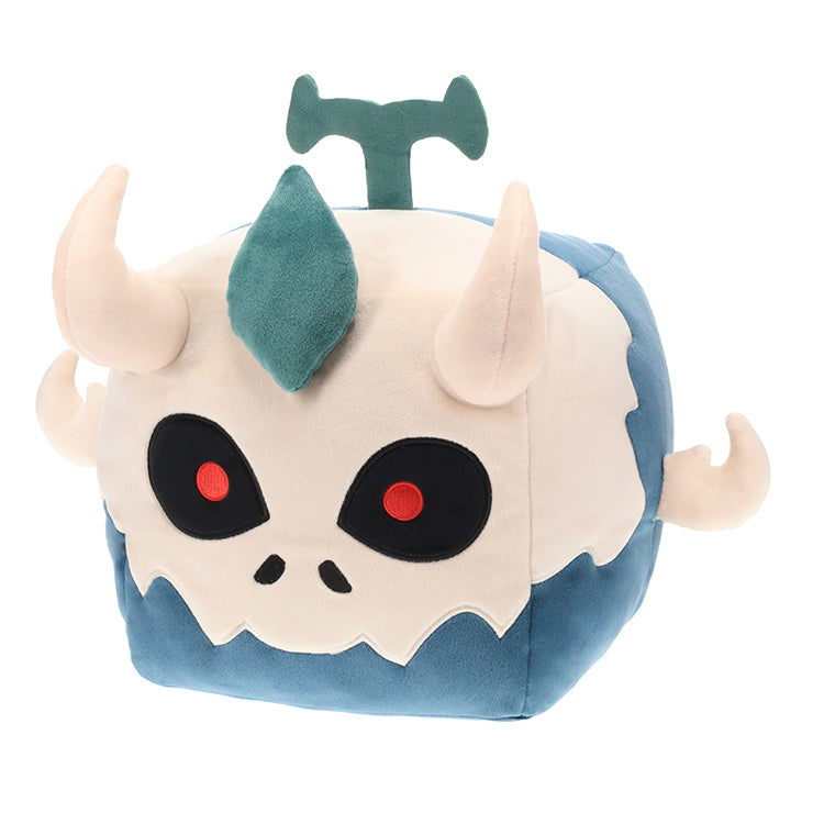 Plush toy with a skull design and horns on a white background