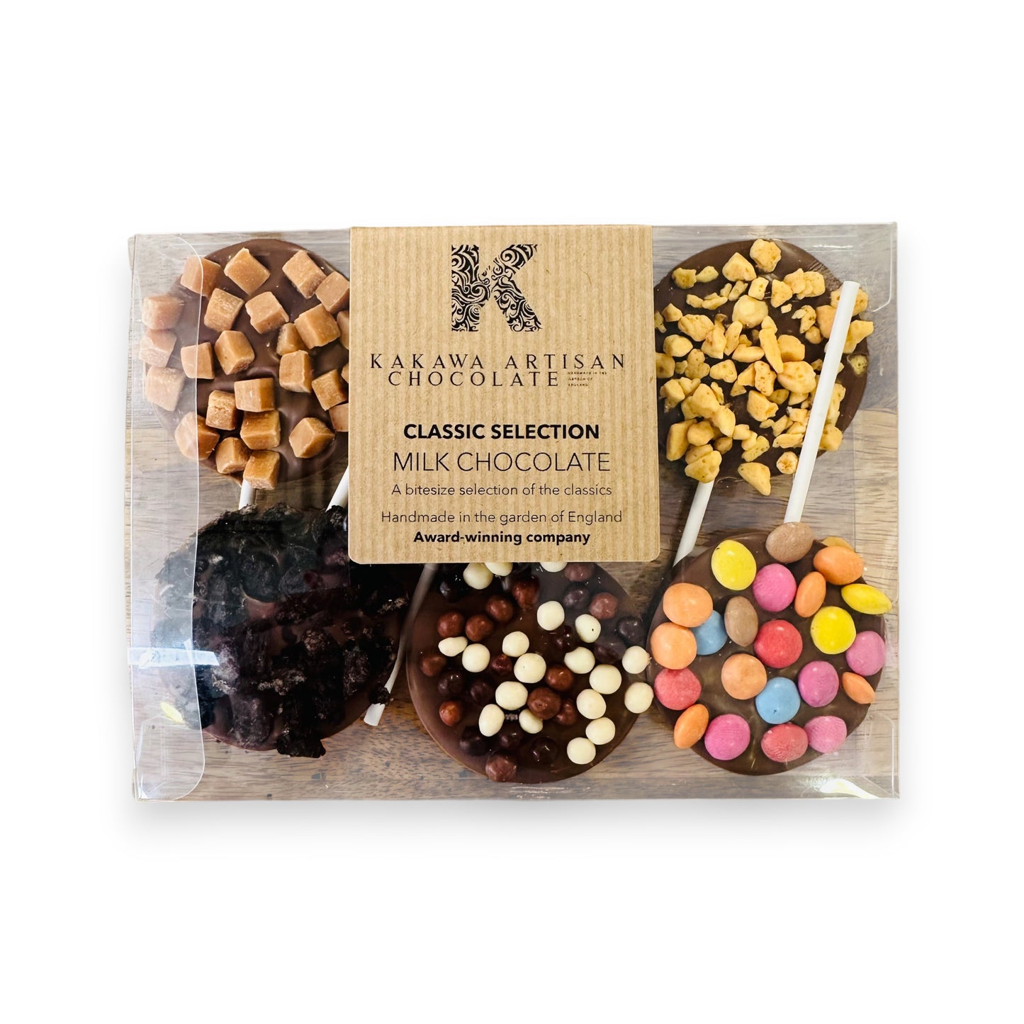 Packaged assortment of milk chocolate bars with various toppings on a white background