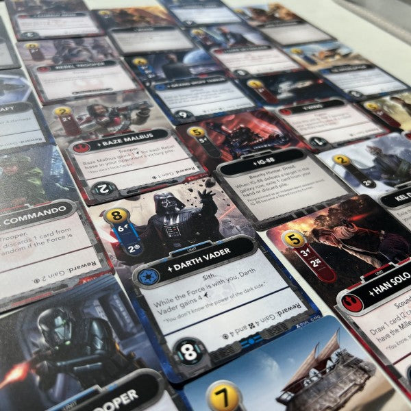 Collection of Star Wars trading cards on a flat surface