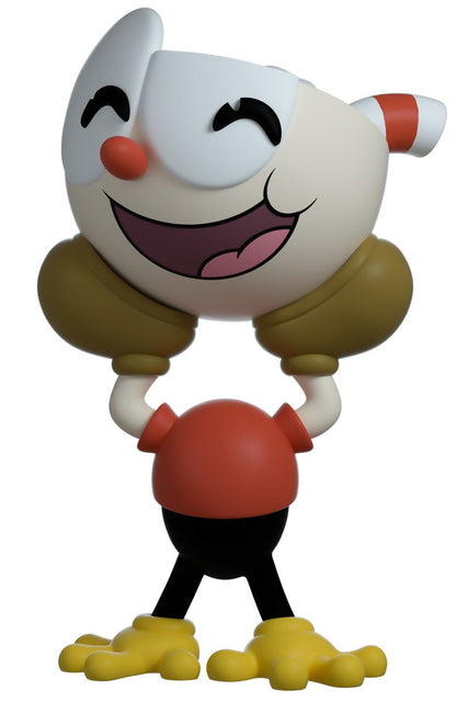 Cartoon character figurine Cuphead with a white face, red nose, and yellow feet on a white background