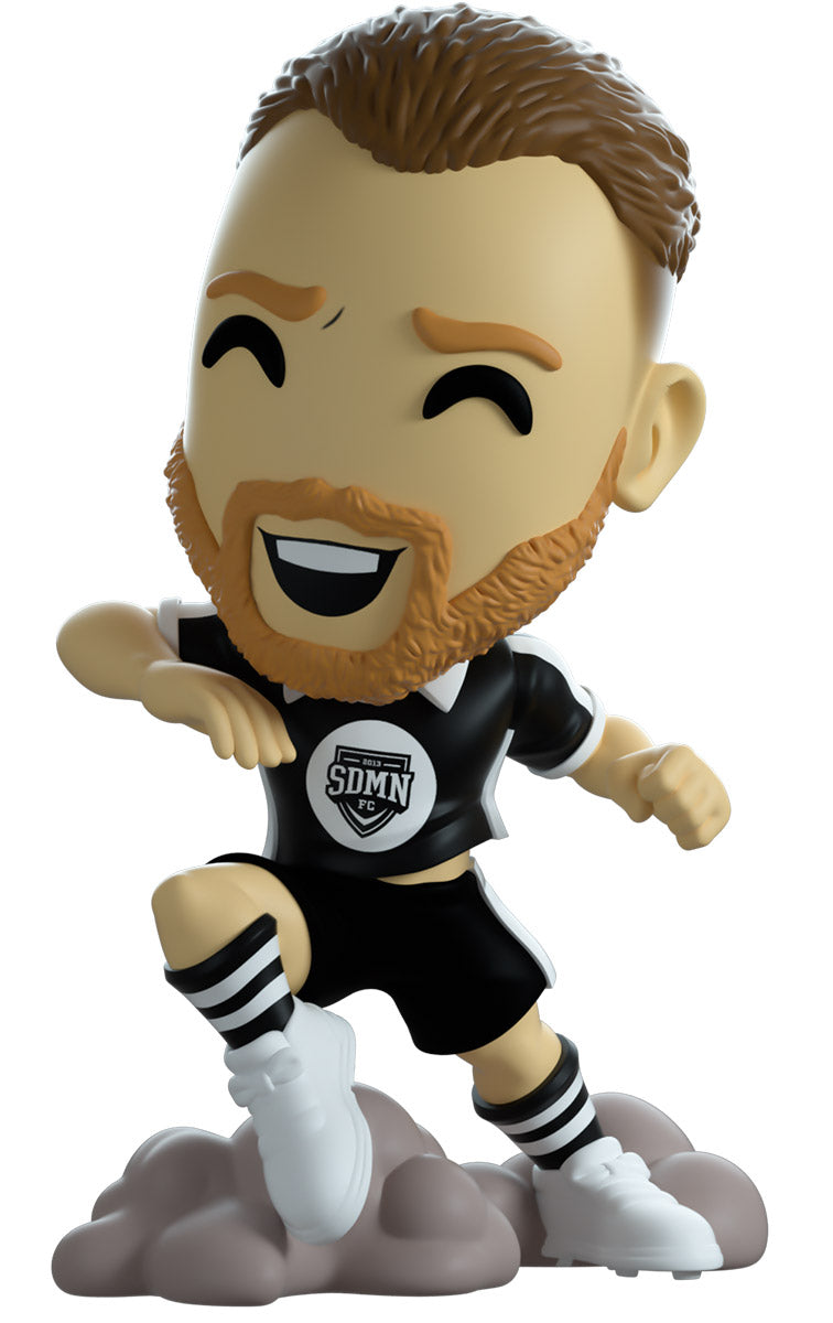 vinyl figure of a football character named 'Behzinga' with branding of YouTooz.