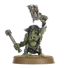 Green fantasy warrior figurine holding a large hammer on a white background
