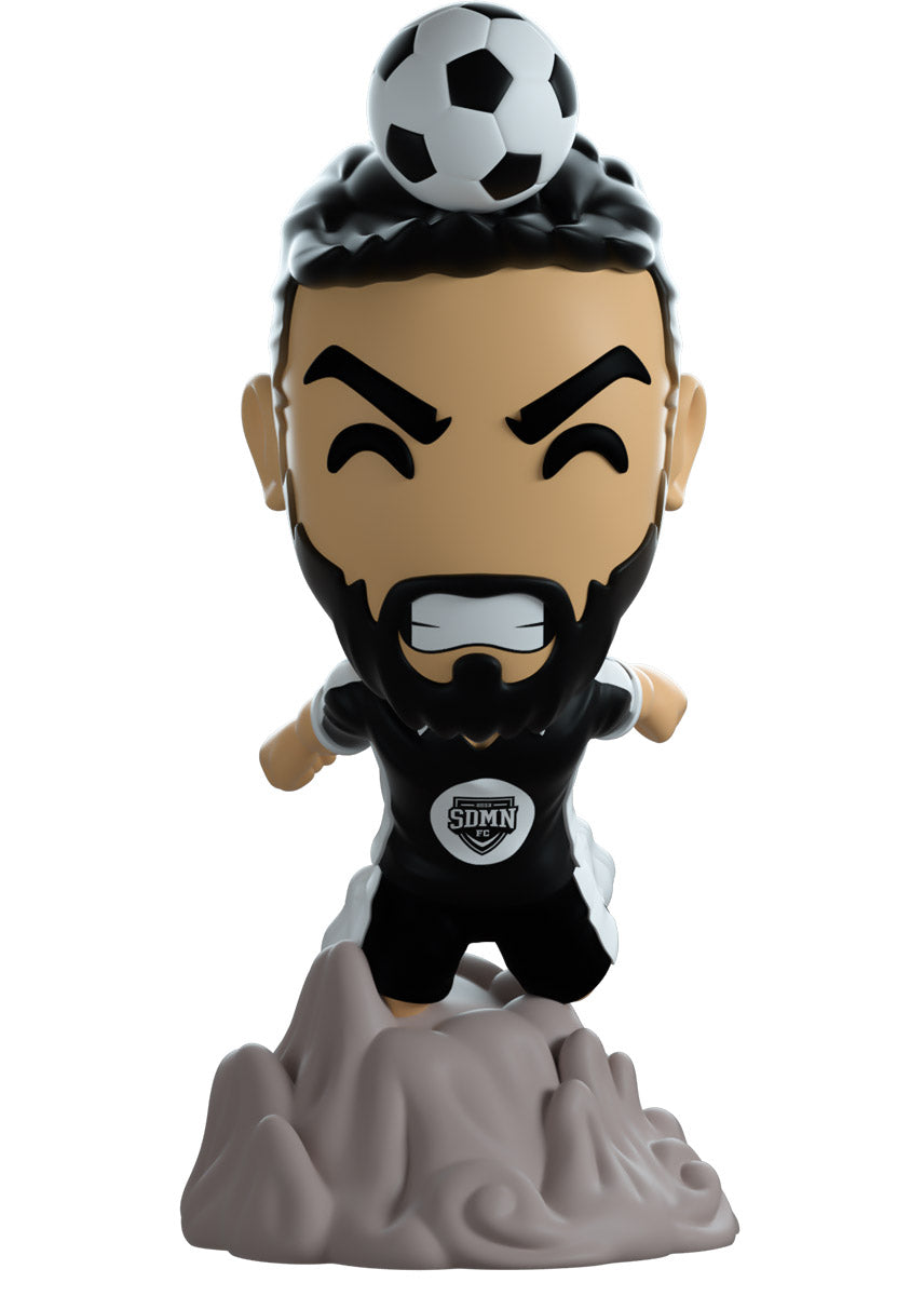 Soccer-themed figurine of Josh from sideman FC with a ball on top of its head against a white background