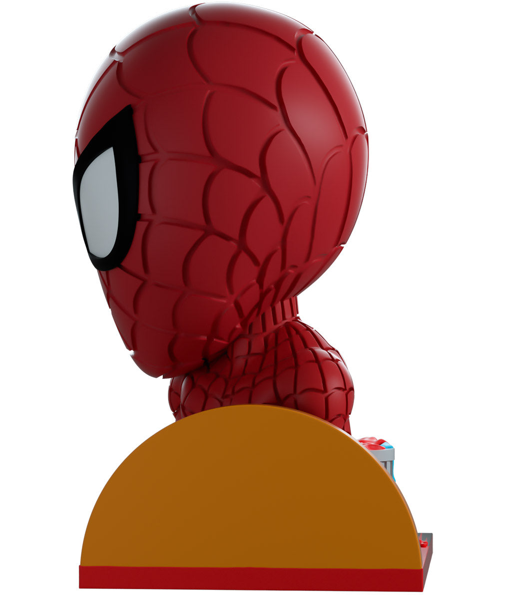 Spider Man figurine with a yellow base on a white background