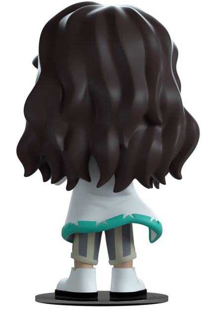 YouTooz vinyl figure ofKlaus a character with long hair and beard, wearing a jacket and shorts.
