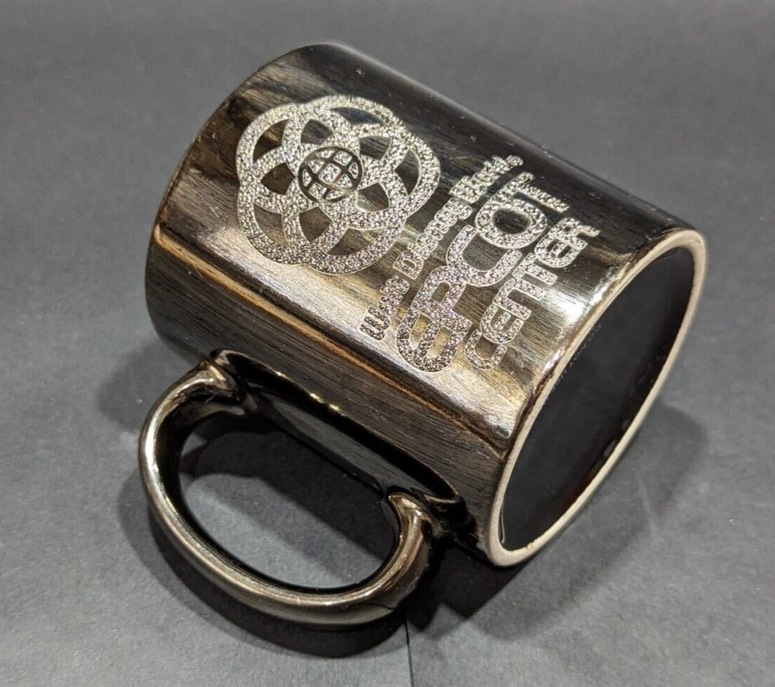 Rare 1980s Walt Disney World Epcot Center smoked chrome mug. Vintage collectible for Disney fans and coffee lovers. Shop now at New, Used and More!