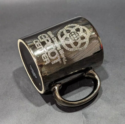 Rare 1980s Walt Disney World Epcot Center smoked chrome mug. Vintage collectible for Disney fans and coffee lovers. Shop now at New, Used and More!