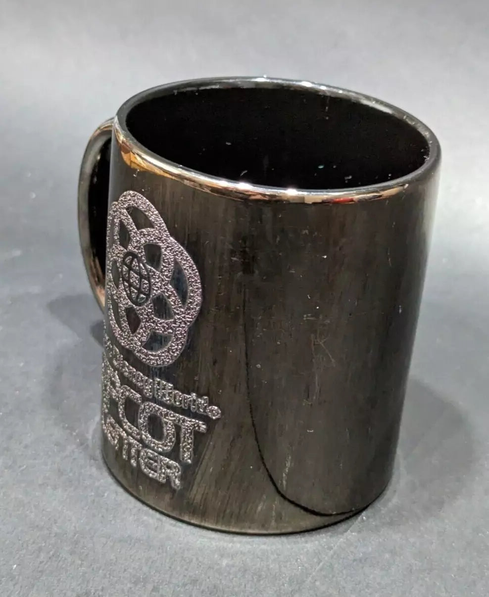 Rare 1980s Walt Disney World Epcot Center smoked chrome mug. Vintage collectible for Disney fans and coffee lovers. Shop now at New, Used and More!