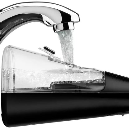 a black coloured waterpik water flosser being filled with water