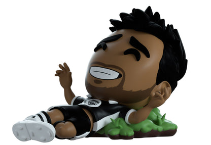 YouTooz Boxed vinyl figure of Vikkstar123. A soccer player with a black and white striped shirt on a white background
