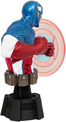Action figure of a superhero in blue and red costume with a shield in the background