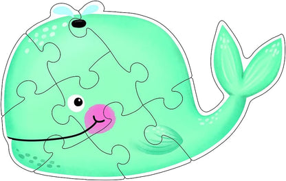 Green whale-shaped puzzle on a white background