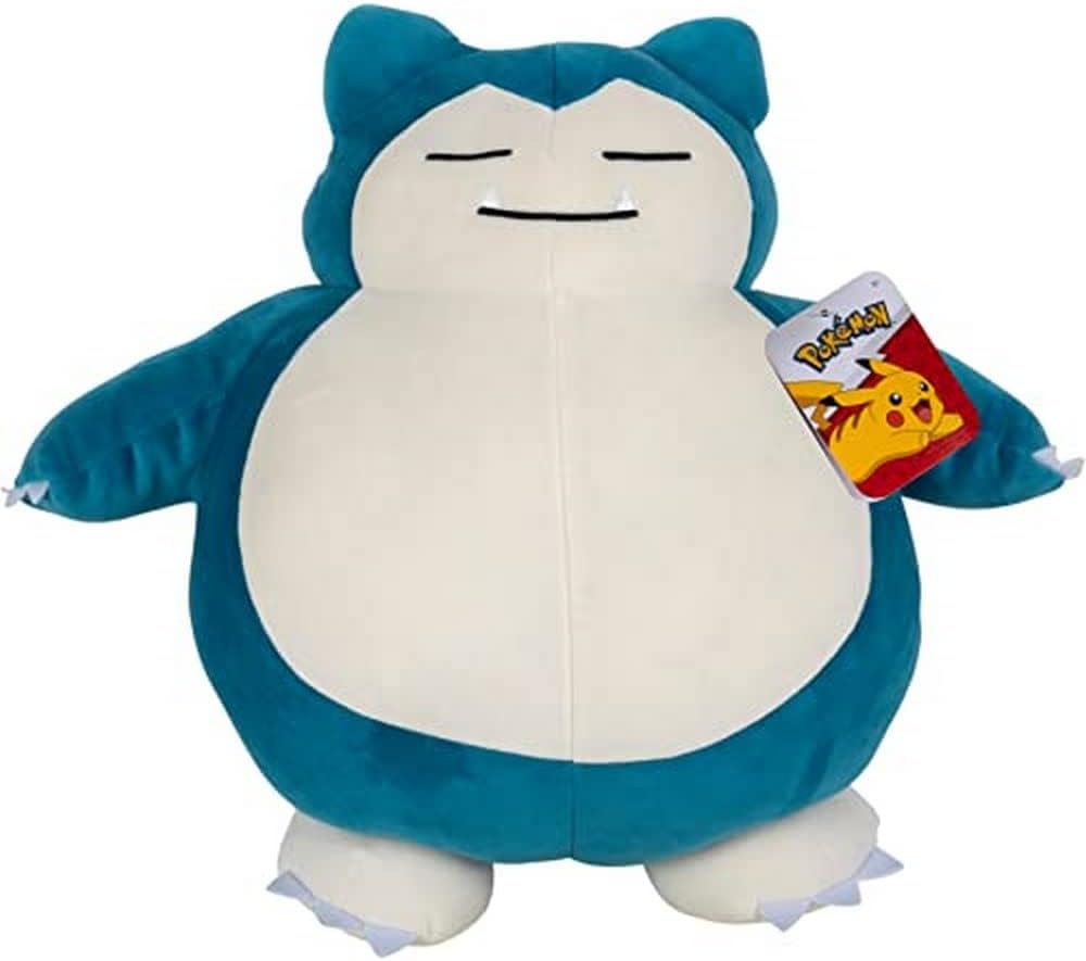 Plush toy Snorlax creature with a Pokémon tag on a white background