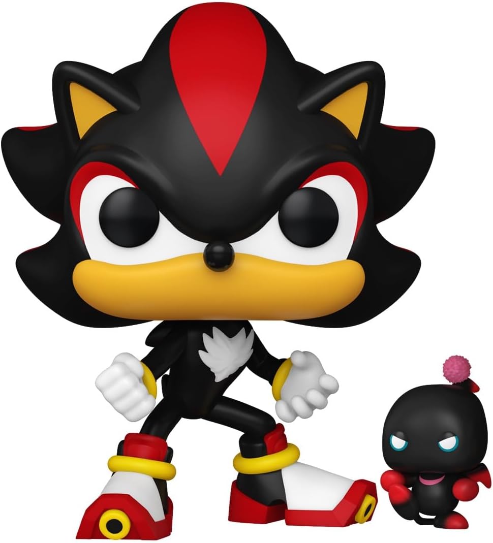 Black and red character figurine with smaller figure on a white background