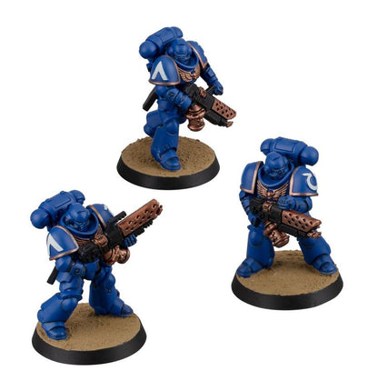 Three blue-armored figures with weapons on brown bases against a white background