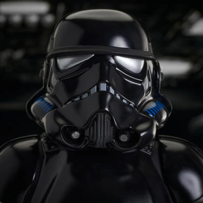 Black stormtrooper helmet with blue accents on a dark background