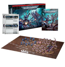 Warhammer 40,000 starter set with miniatures and game components on a white background