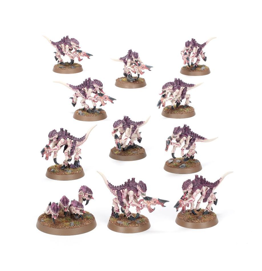 Collection of miniature dinosaur models on a white background