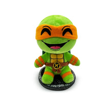 TMNT Green plush toy with orange mask on a white background