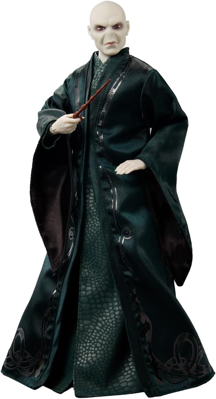 Voldermort figure in dark robe with snake pattern holding a wand on a white background