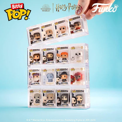Collection of Funko Pop! vinyl figures in packaging with Bitty Pop!, Warner Bros., and Harry Potter branding on a blue background.