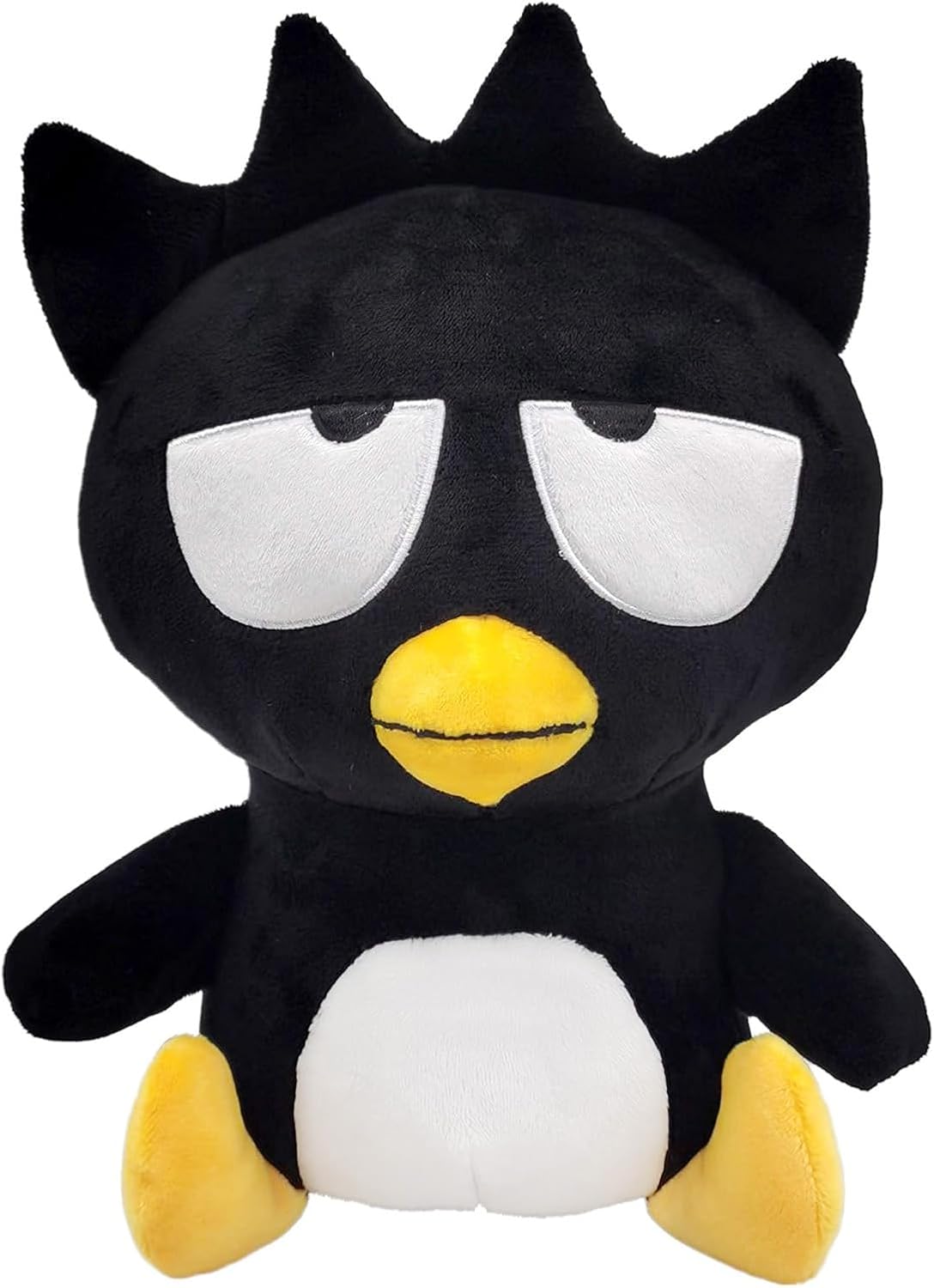 Black plush toy with white face and yellow beak and feet on a white background