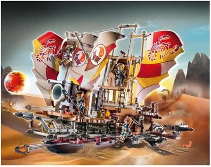 Detailed model of a steampunk-style airship with intricate designs against a desert landscape.