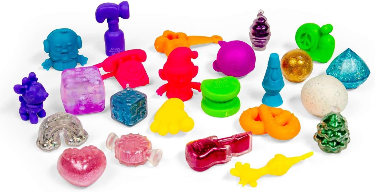 Assorted colorful plastic toys on a white background