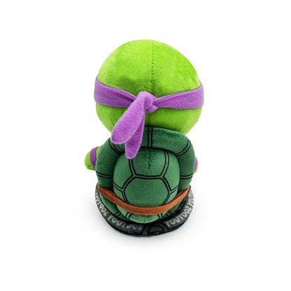 TMNT Green plush toy with a purple bandana on a white background