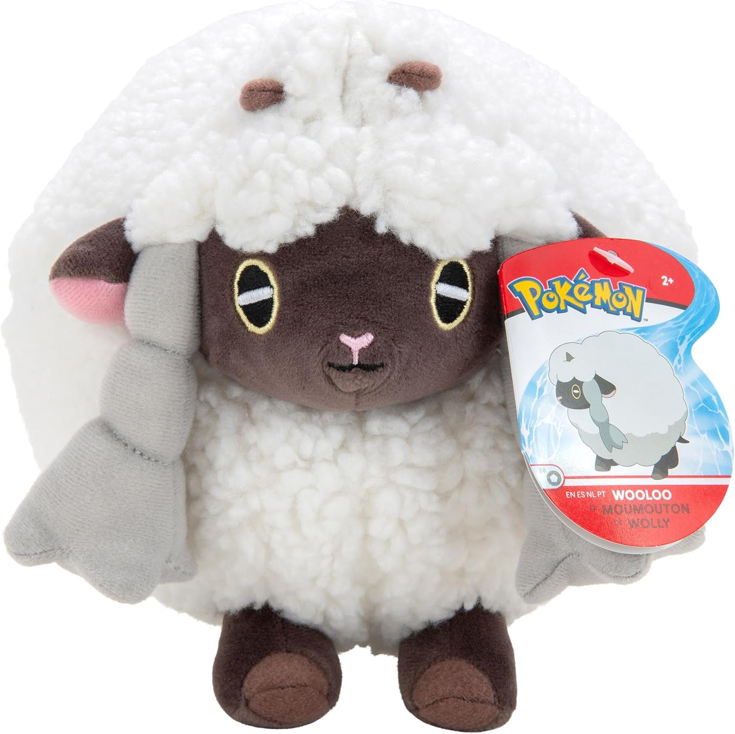 Plush toy resembling Wooloo from Pokemon with a tag on a white background