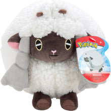 Plush toy resembling Wooloo from Pokemon with a tag on a white background