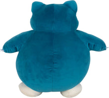 Blue plush toy Snorlax with white paws on a white background
