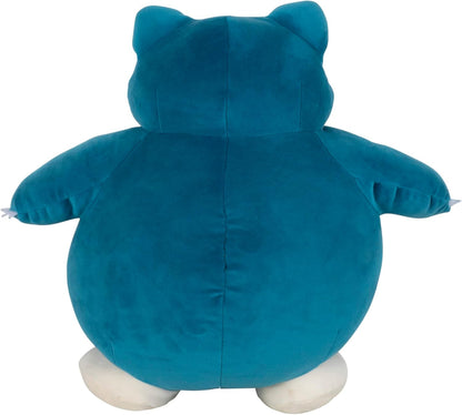 Blue plush toy Snorlax with white paws on a white background