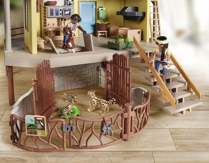 Toy playset with animals and people on a wooden floor