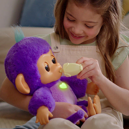Child playing with a purple toy monkey
