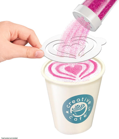 Hand pouring pink glitter into a cup of coffee with 'Creative Cafe' logo