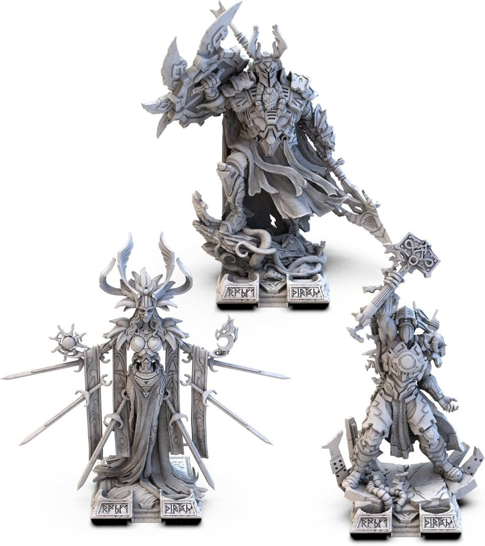 Three fantasy figurines with intricate designs on a white background
