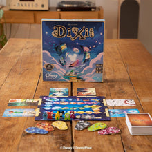 DiXiit board game with Disney edition packaging on a wooden table