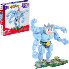 Machamp Blue robot-like figure with a yellow belt and red eyes, next to its packaging