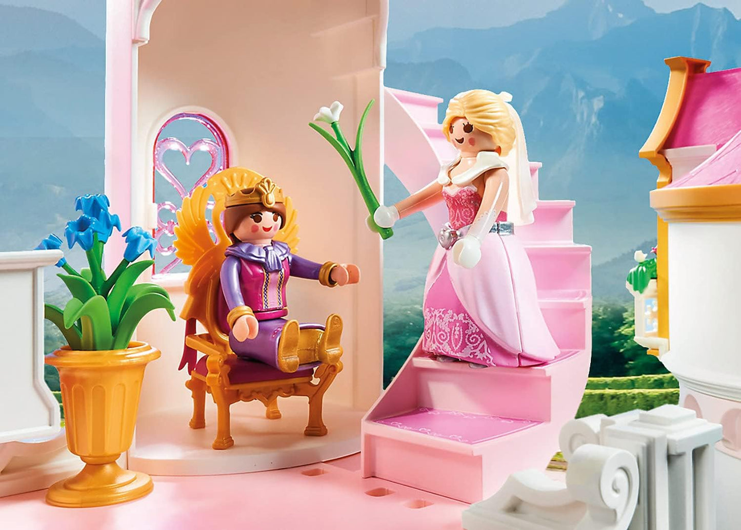 Playmobil princess figure in a castle setting with another figure on a throne.