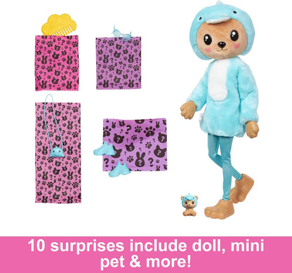 Toy doll in a blue outfit with packaging and small toys on a white background
