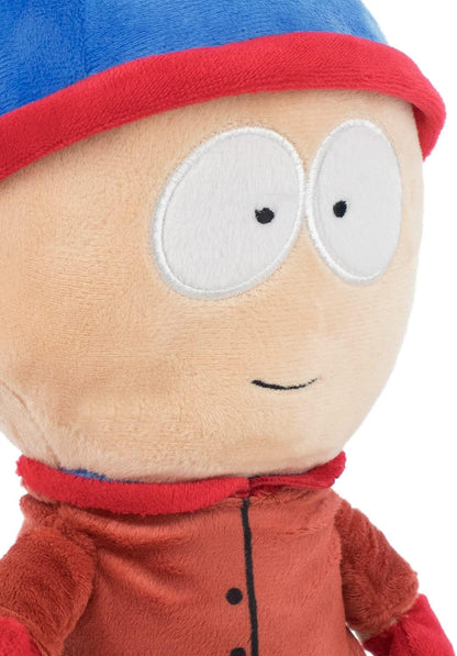 Plush toy with a blue hat and red shirt on a white background