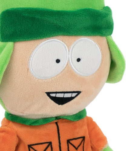 Plush toy with green hair and orange shirt on a white background