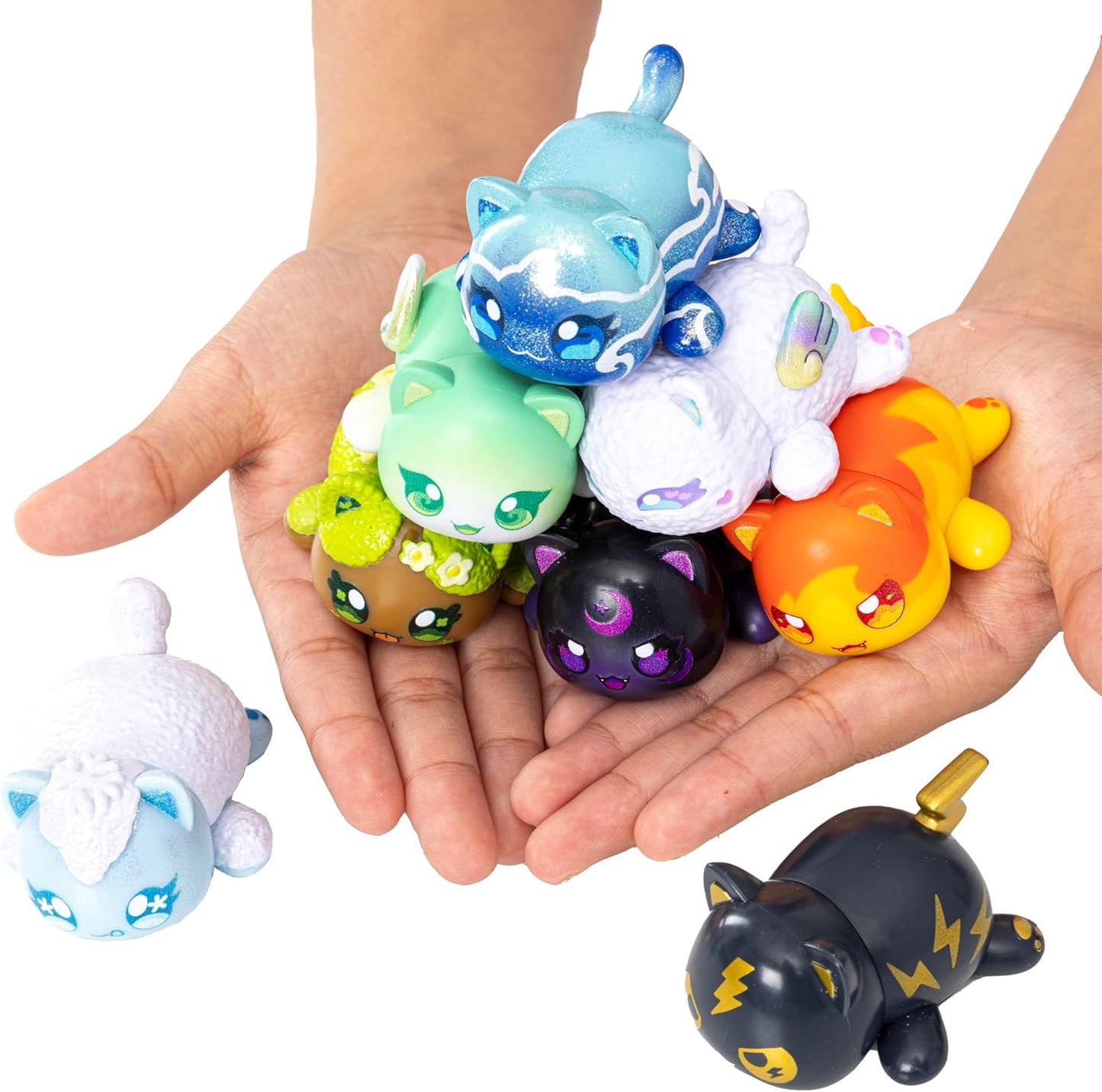 Colorful Aphmau animal figurines held in a hand against a white background