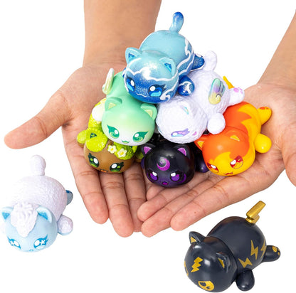 Colorful Aphmau animal figurines held in a hand against a white background