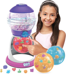 Girl interacting with a colorful toy machine filled with decorative balls on a white background
