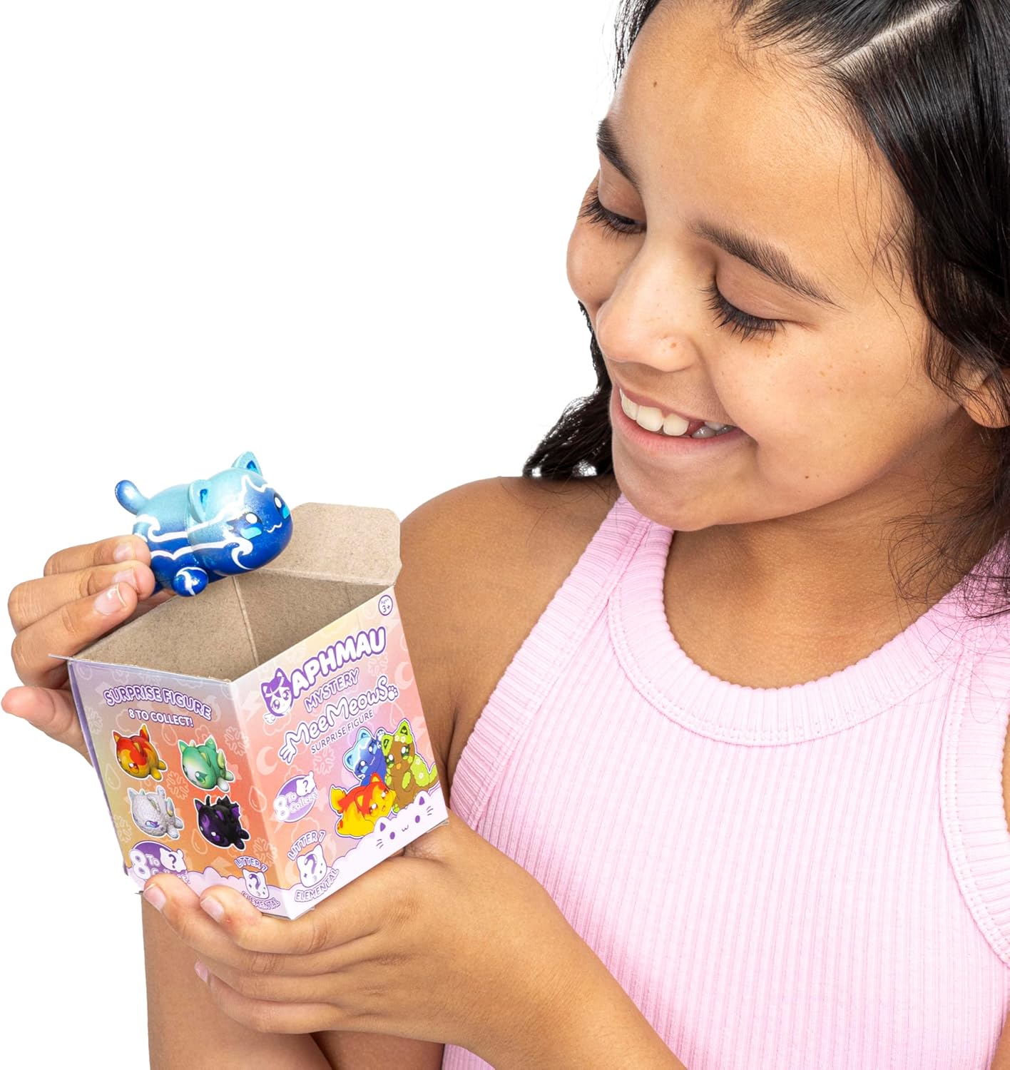 Girl holding an Aphmau toy and its packaging with a visible brand logo.