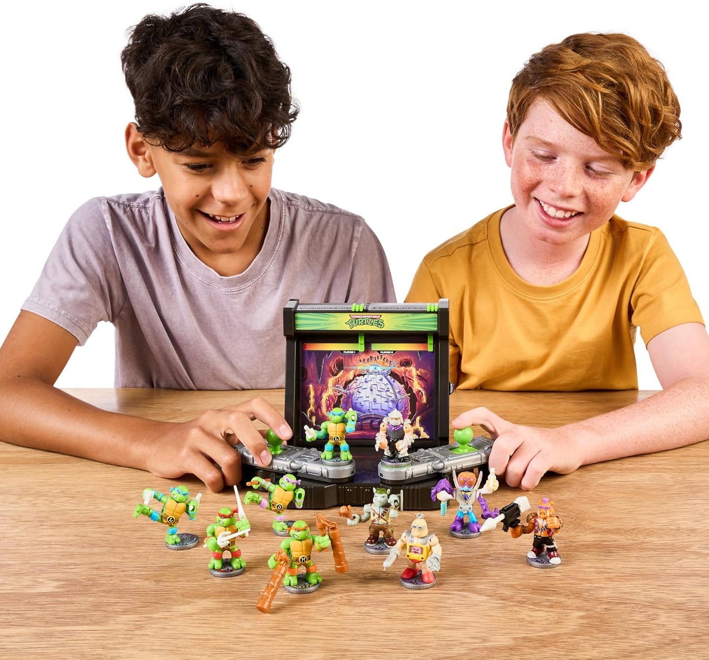 Two children playing with TMNT toy figures on a table